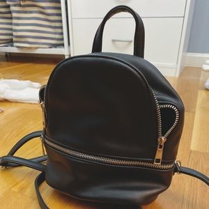 Leather Backpack with Silver Zipper